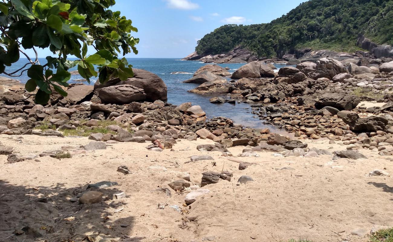 Photo of Galhetas Beach with bright sand & rocks surface