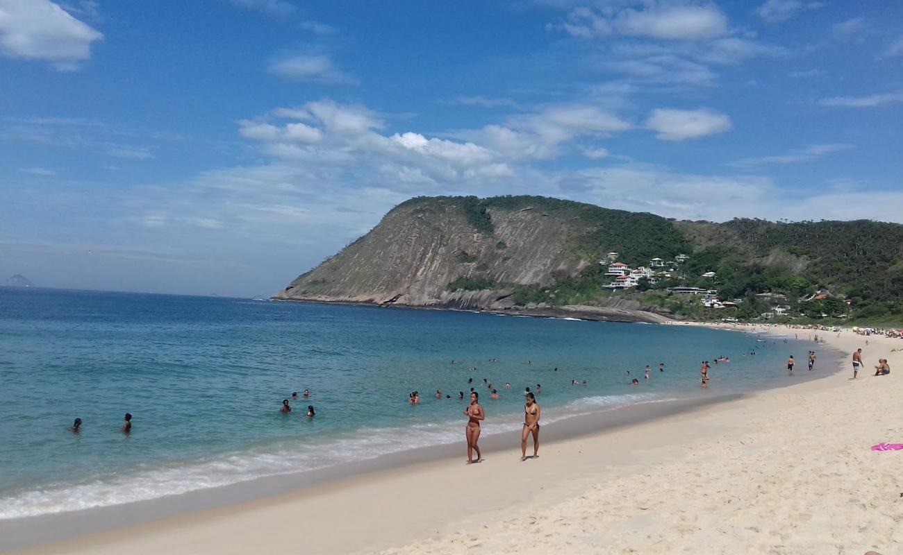 Photo of Itacoatiara Beach with bright fine sand surface