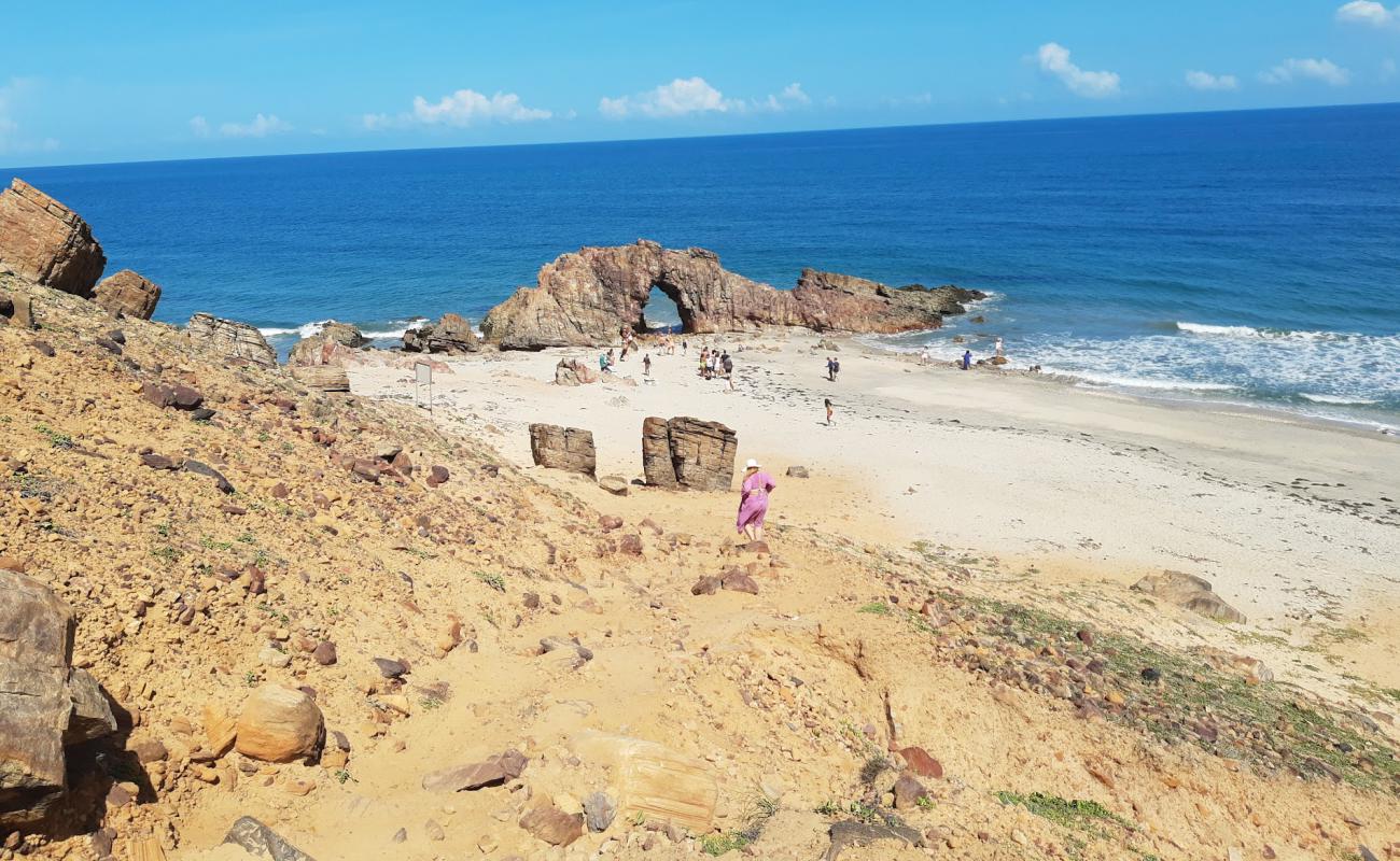 Photo of Pedra do Frade Beach with bright sand & rocks surface