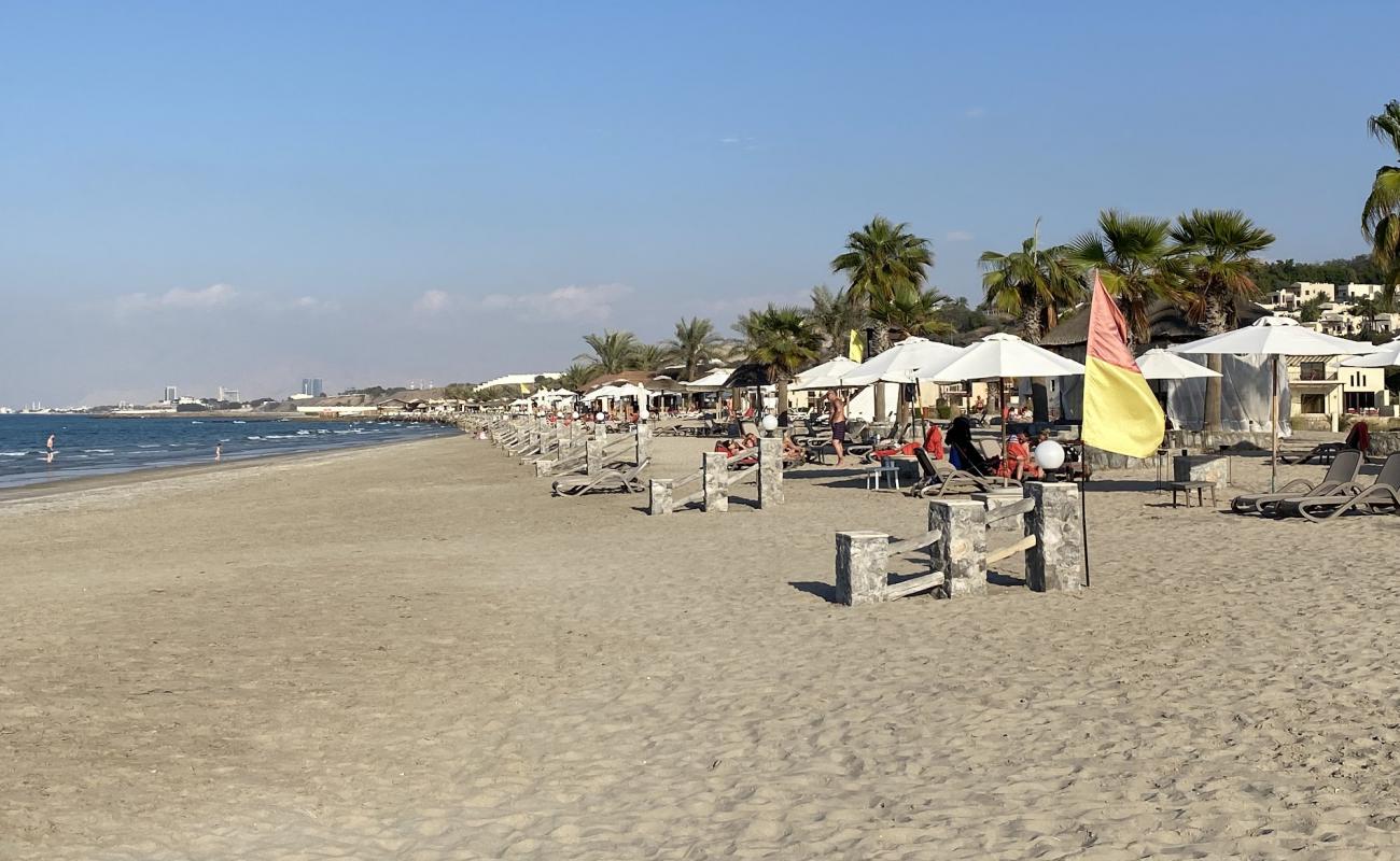 Photo of Cove Rotana resort with bright fine sand surface