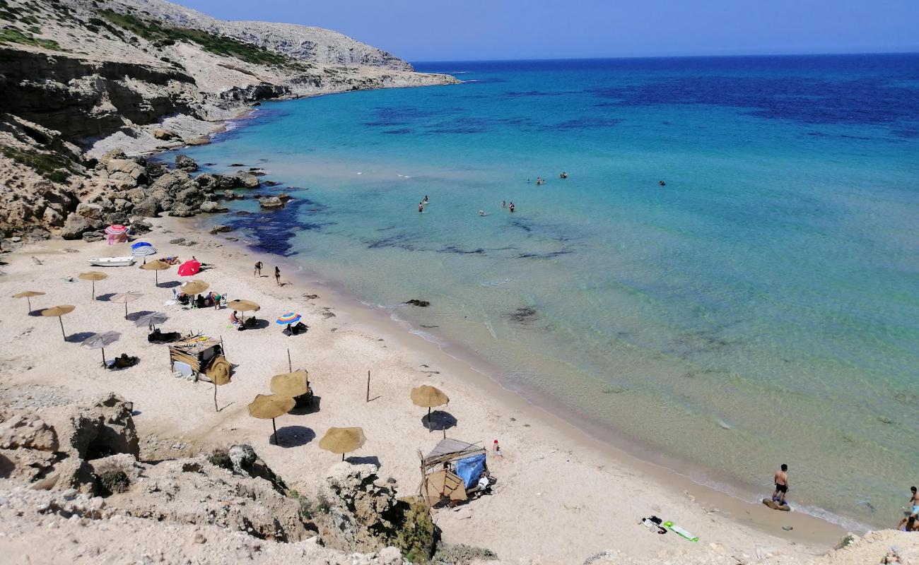 Photo of La Grotte beach with bright fine sand surface