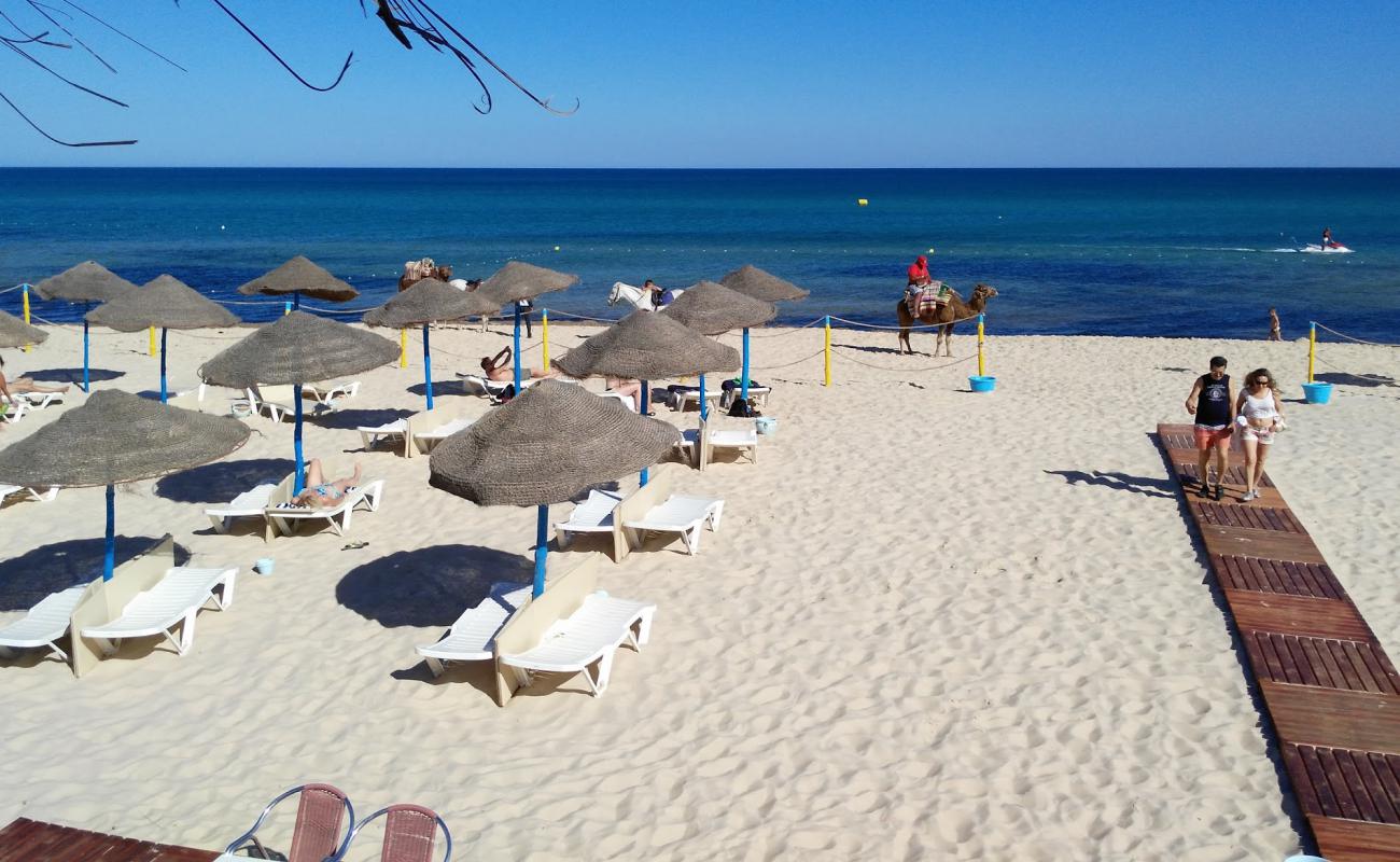 Photo of Plage Jinene Hammamet with bright fine sand surface