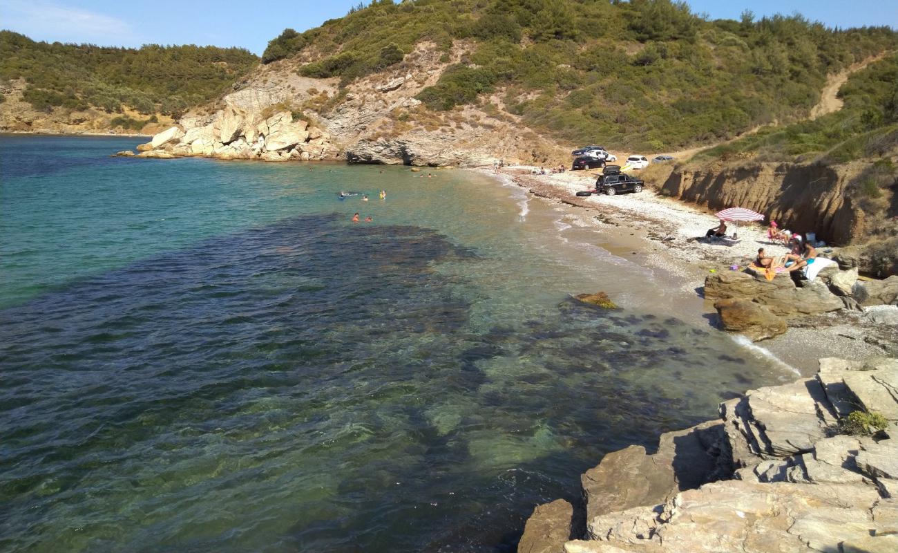 Photo of Akcaylar Bay with white pebble surface