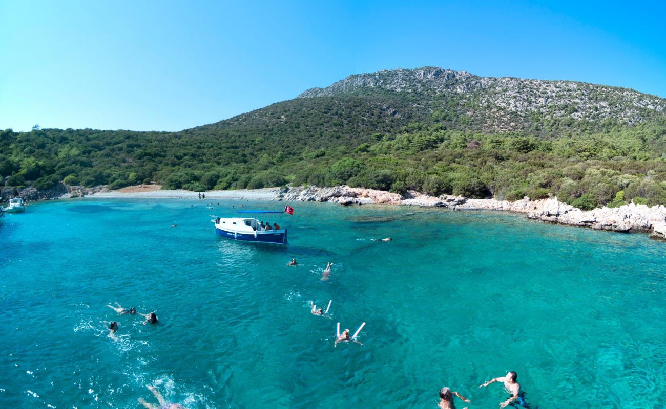 Photo of Aquarius Bay with light pebble surface