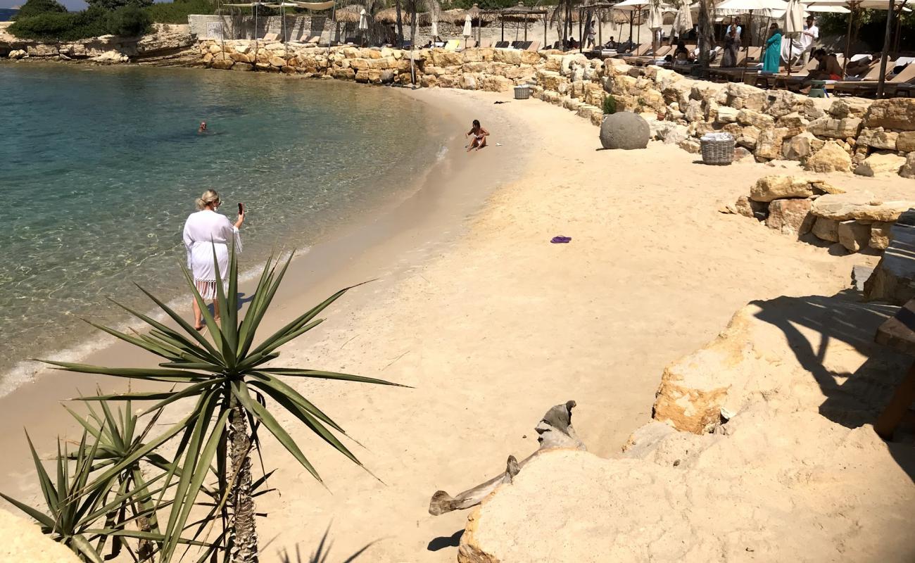 Photo of The Beach of Momo with bright fine sand surface