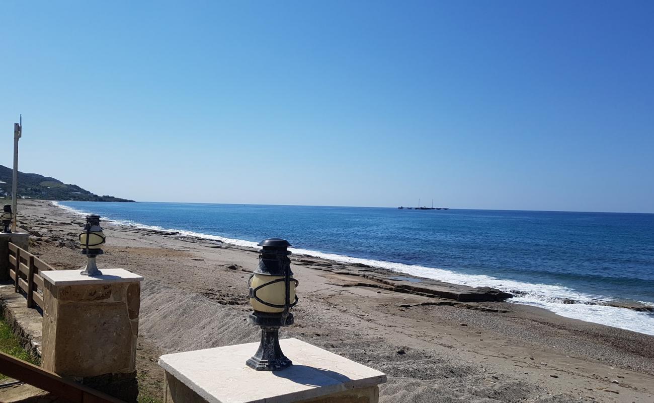 Photo of Demirtas beach II with brown sand &  rocks surface