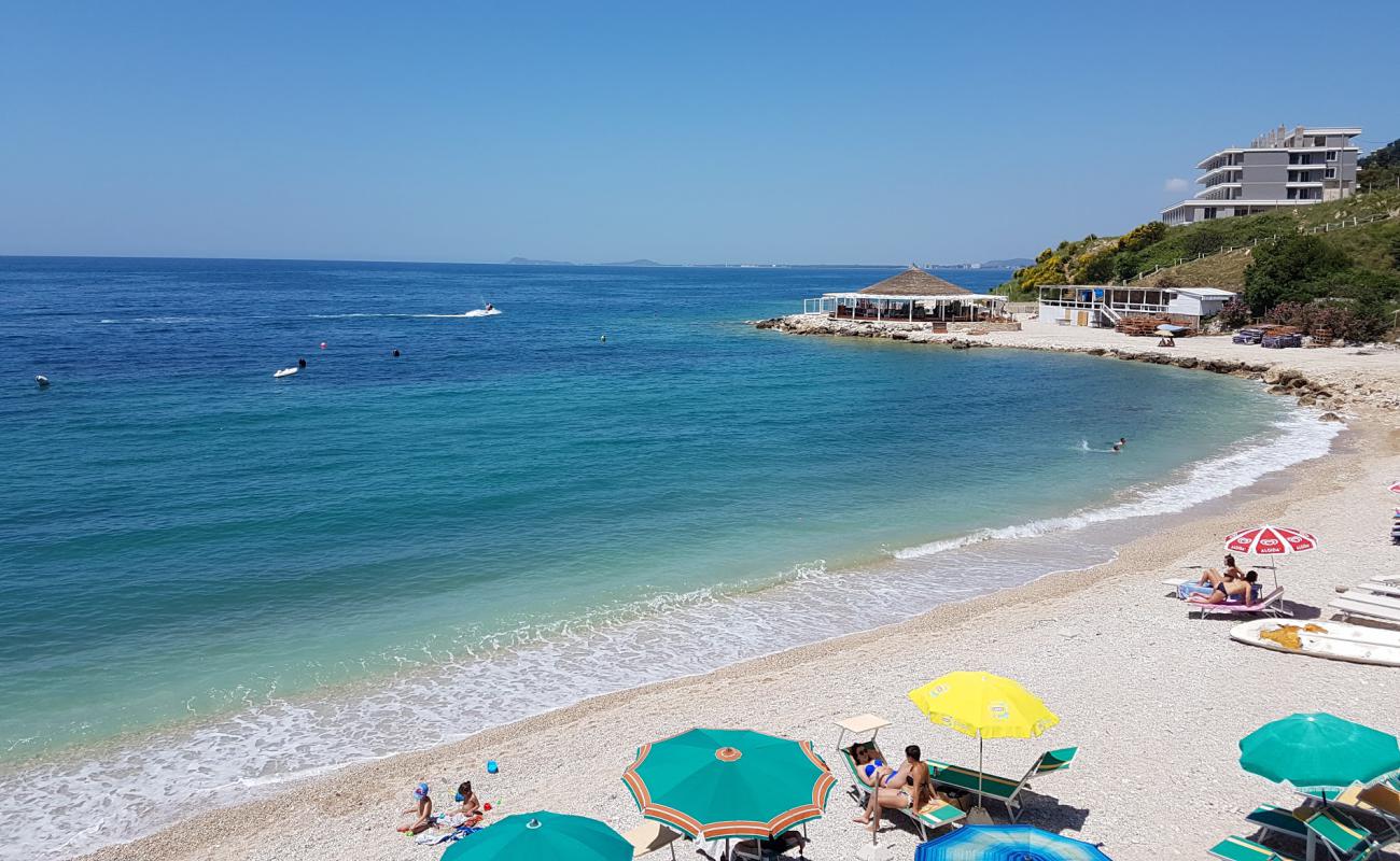 Photo of Sunny beach with light pebble surface