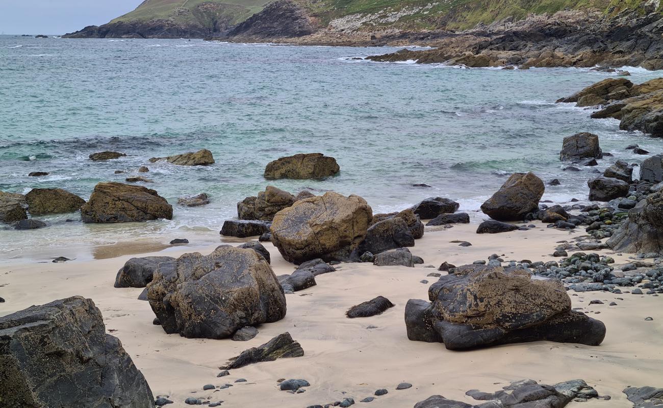 Photo of Porthzennor Cove with rocks cover surface