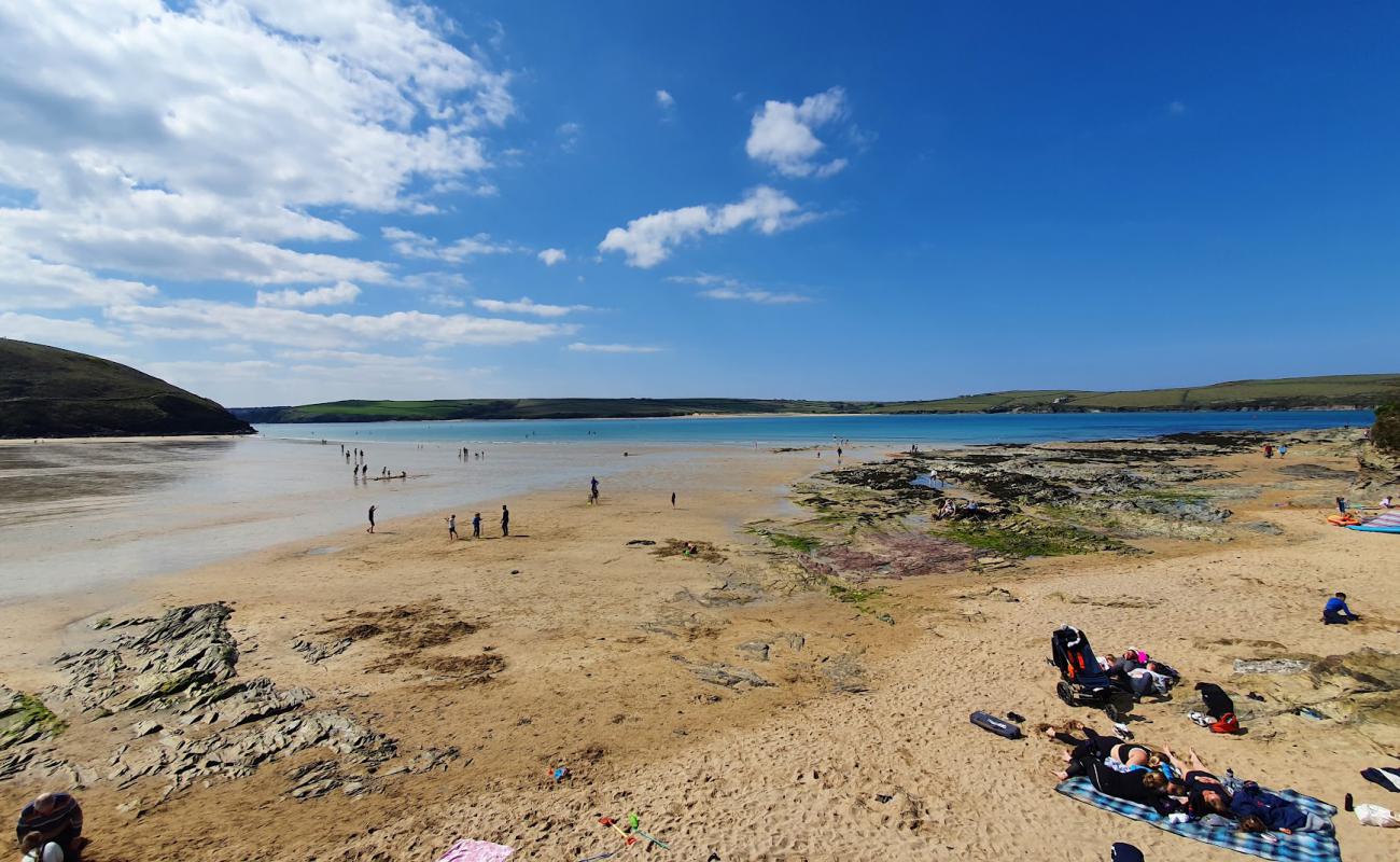 Photo of Daymer Bay with bright sand surface