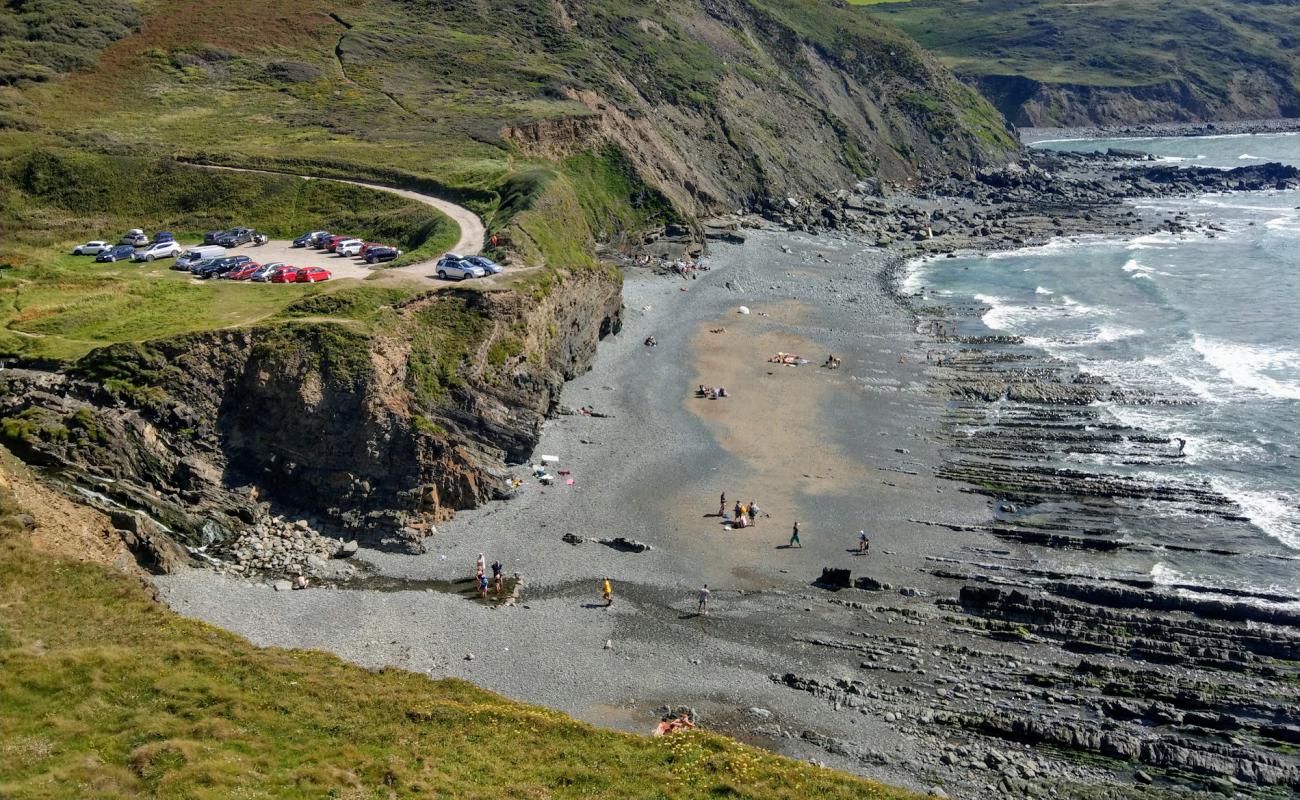 Photo of Welcombe Mouth beach with bright sand & rocks surface