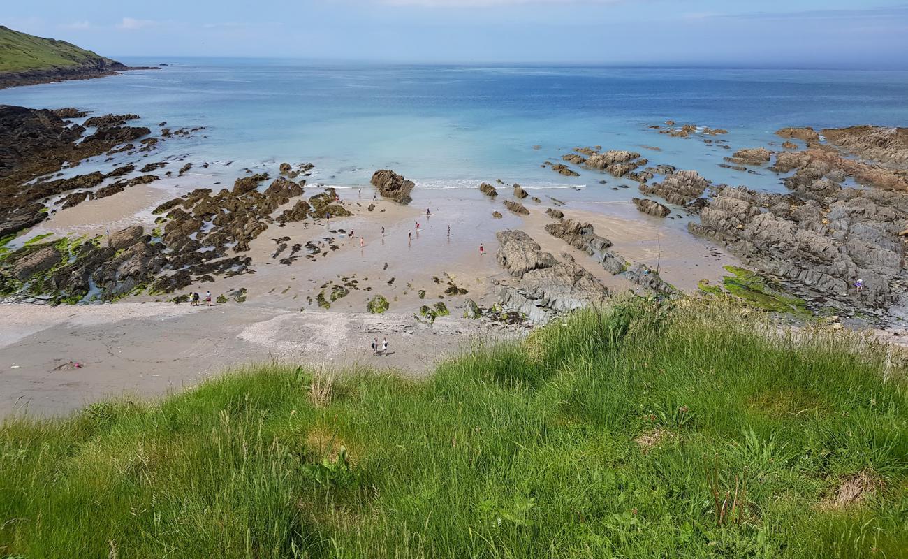 Photo of Rockham beach with bright sand & rocks surface