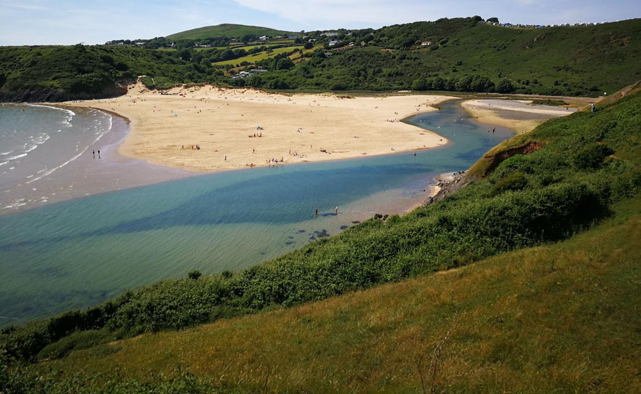 Photo of Three Cliffs Bay with bright fine sand surface