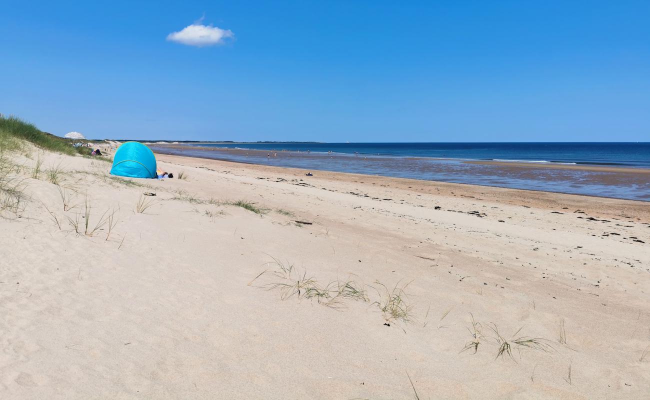 Photo of Druridge Bay beach with bright sand surface