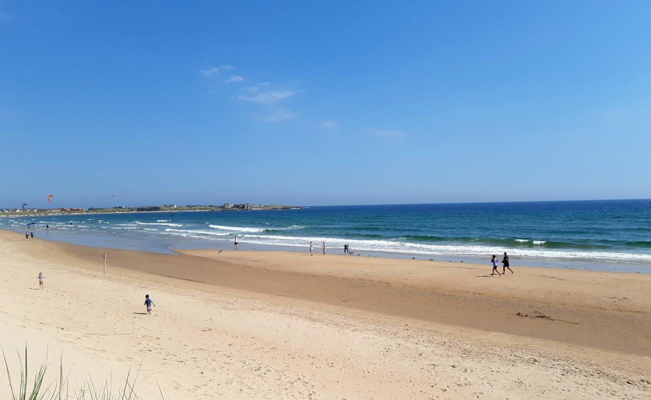 Photo of Beadnell Bay beach with bright sand surface