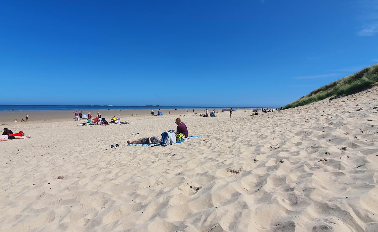 Photo of Bamburgh Beach with bright sand surface