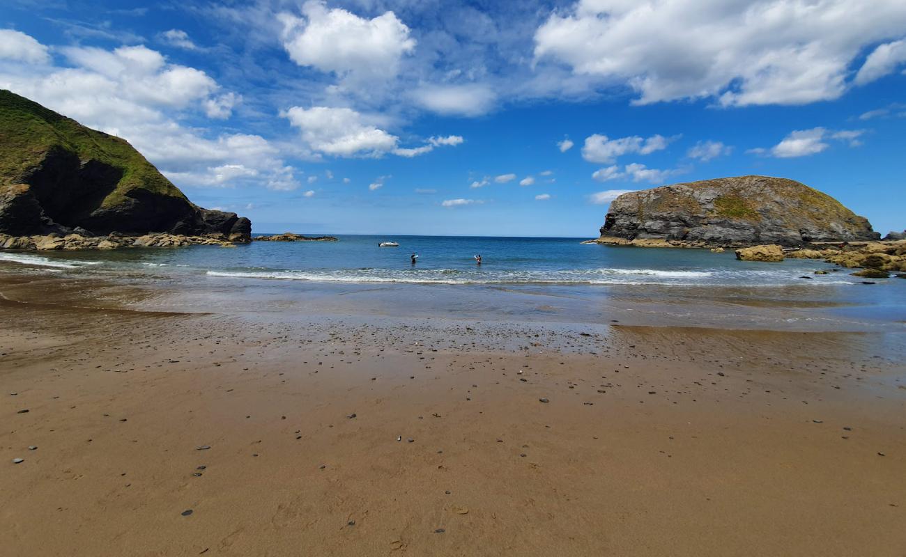 Photo of Llangrannog Beach with bright sand surface