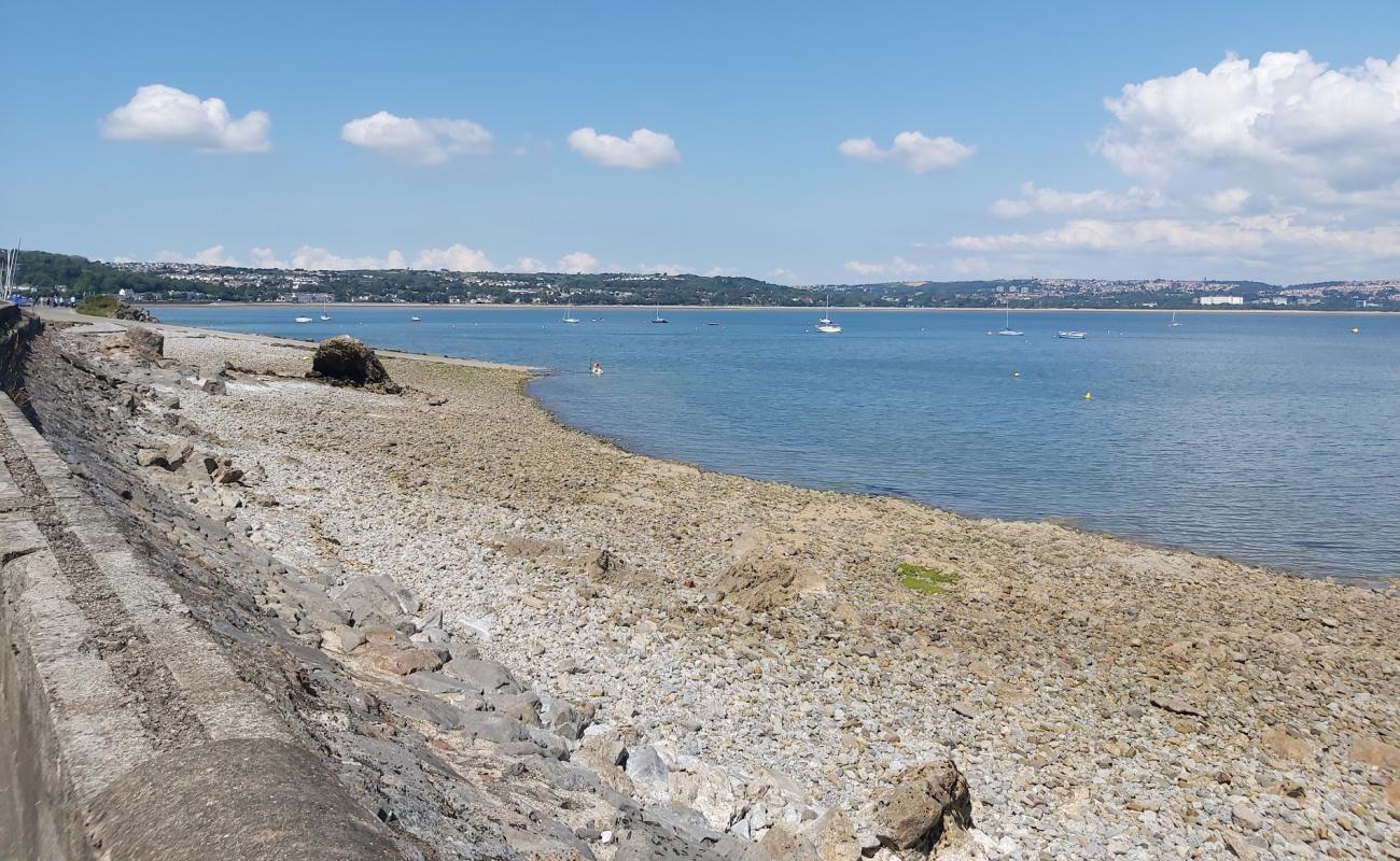 Photo of Mumbles beach with bright sand & rocks surface