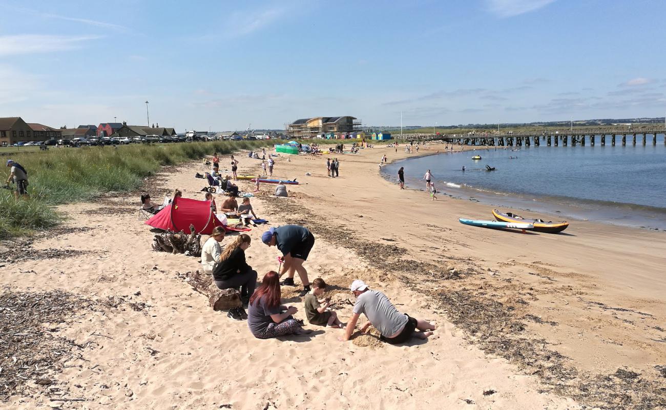 Photo of Amble Beach with bright sand surface