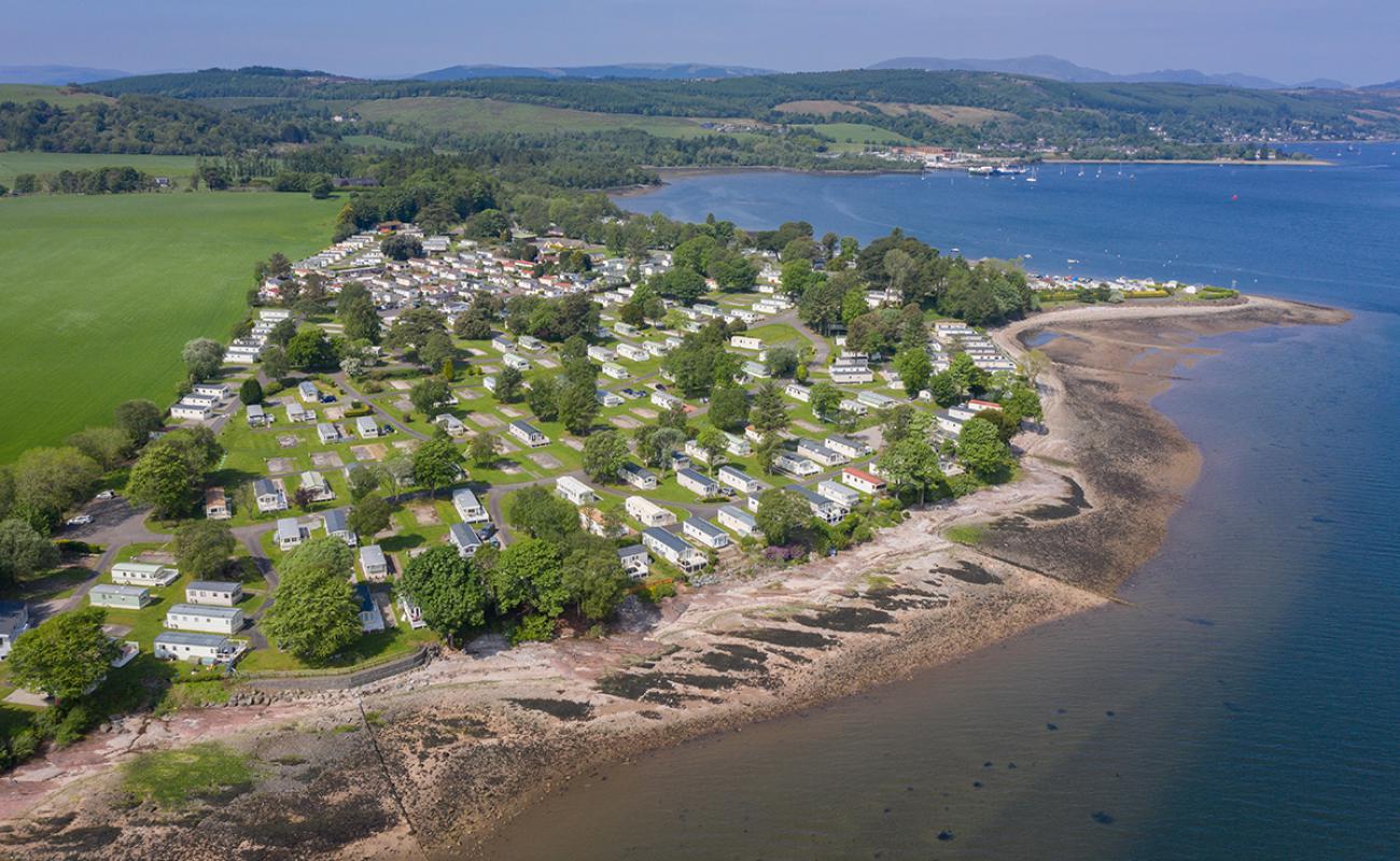 Photo of Rosneath Castle Park Beach with light sand &  pebble surface