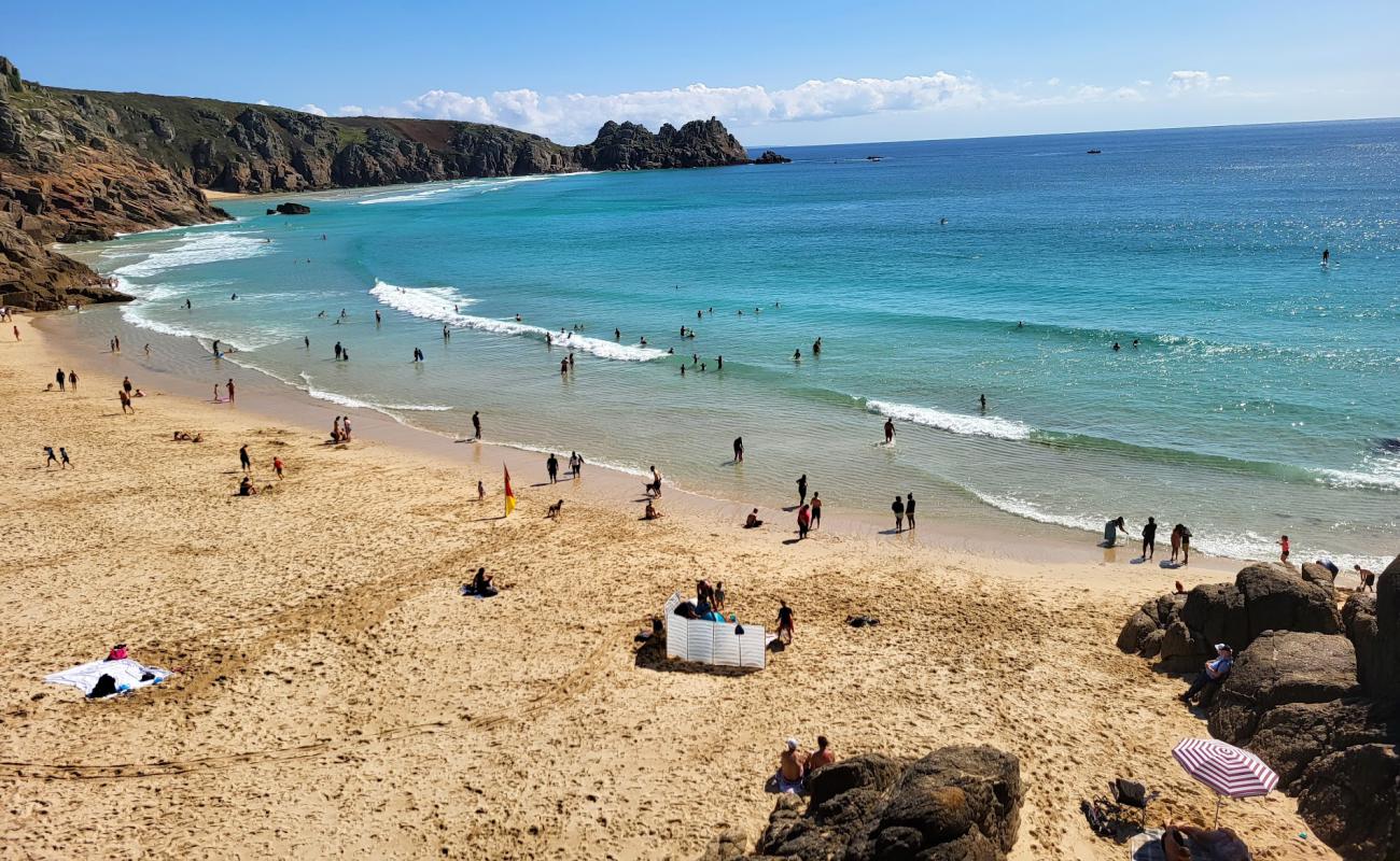 Photo of Porthcurno Beach with bright sand surface