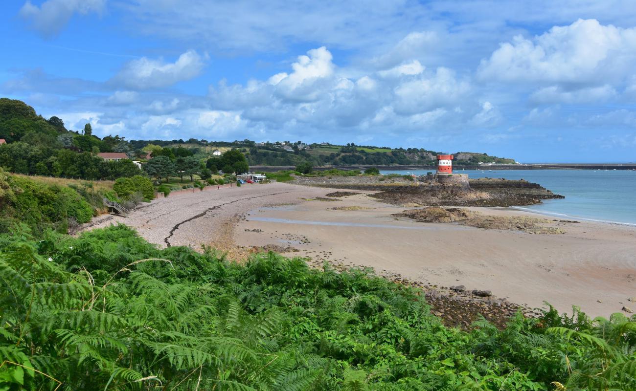 Photo of Archirondel Beach with brown pebble surface