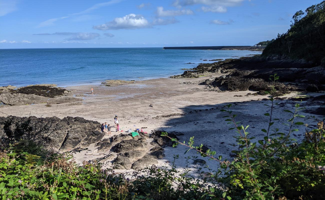 Photo of La Coupe Bay with light sand &  pebble surface