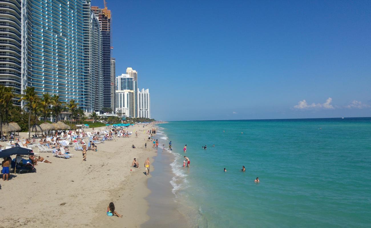 Photo of Sunny Isles beach with bright shell sand surface