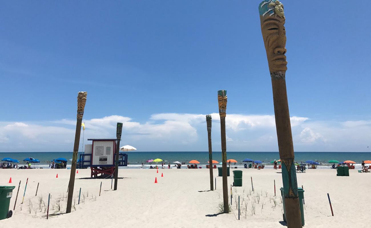 Photo of Cocoa beach with bright sand surface