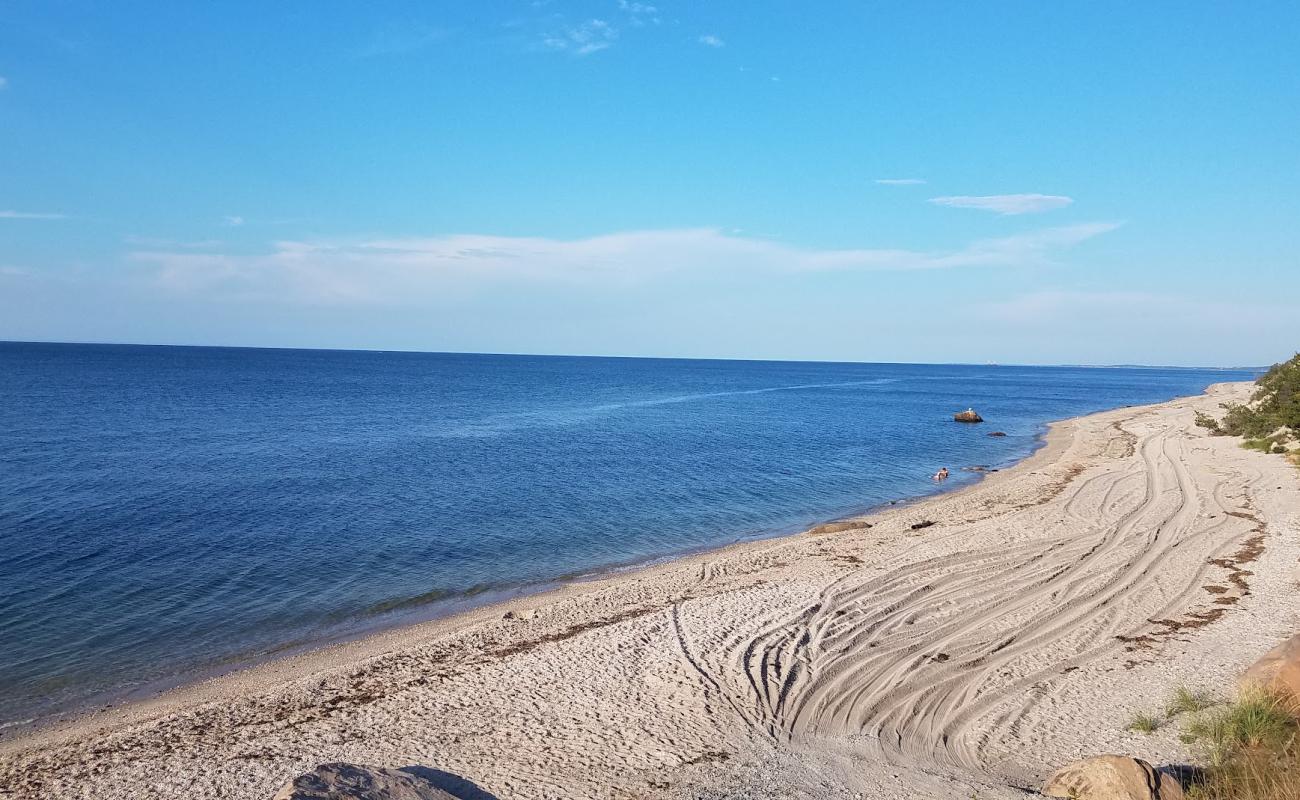 Photo of Reeves Beach with gray sand surface