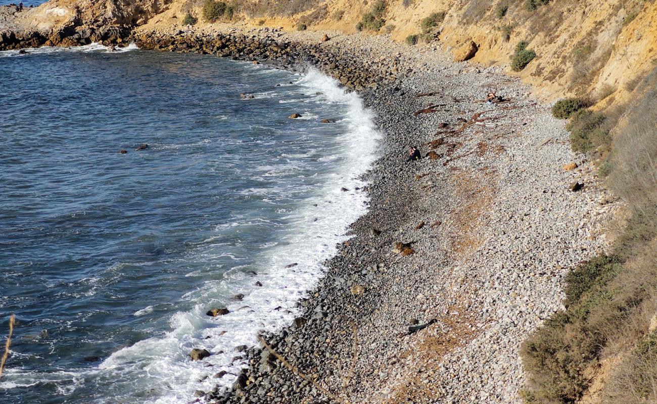 Photo of Asiri Rock beach with gray sand &  rocks surface