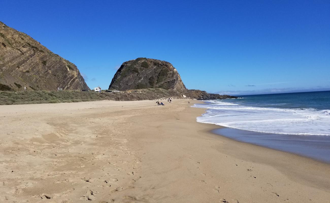 Photo of Mugu beach with bright fine sand surface