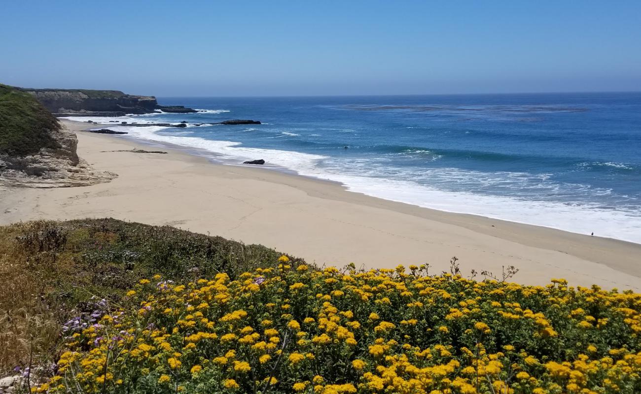 Photo of Red, White and Blue Beach with bright sand surface