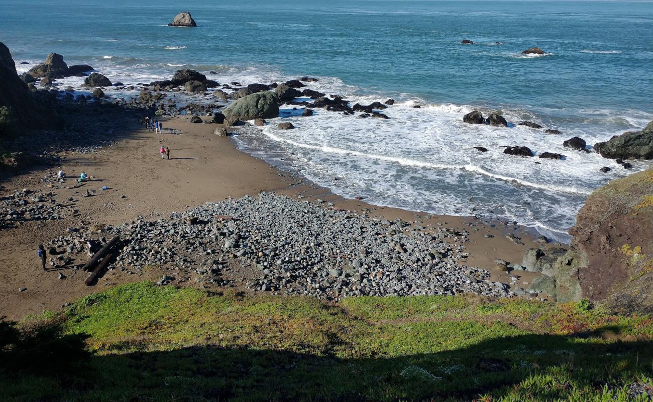 Photo of Mile Rock Beach with gray sand &  rocks surface