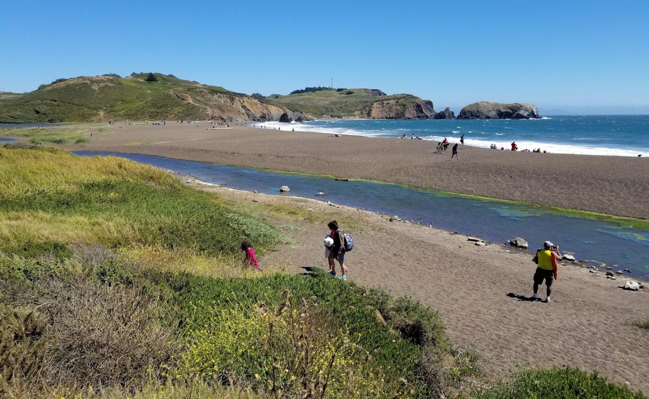 Photo of Rodeo Beach with gray sand surface