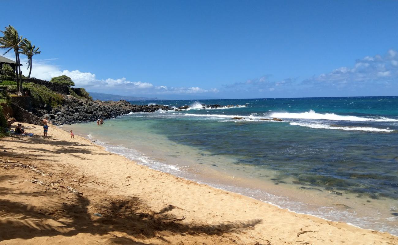 Photo of Kuau Cove Beach with bright sand & rocks surface