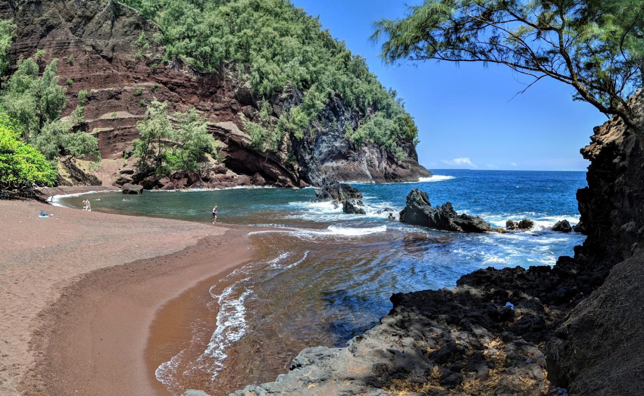 Photo of Kaihalulu Beach with brown fine pebble surface