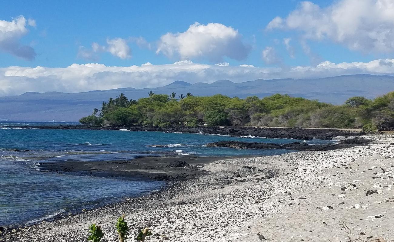 Photo of Holoholokai Beach with gray sand &  rocks surface