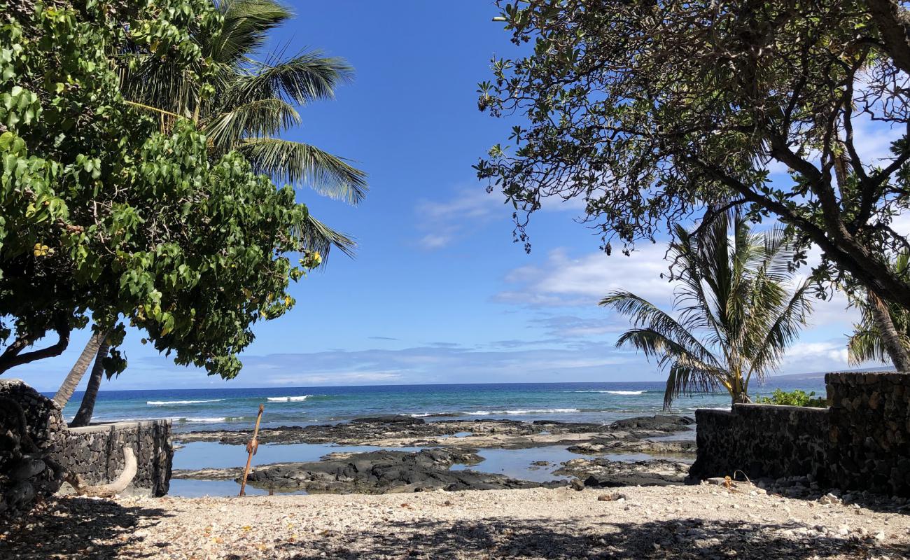 Photo of Puakō Beach with gray sand &  rocks surface