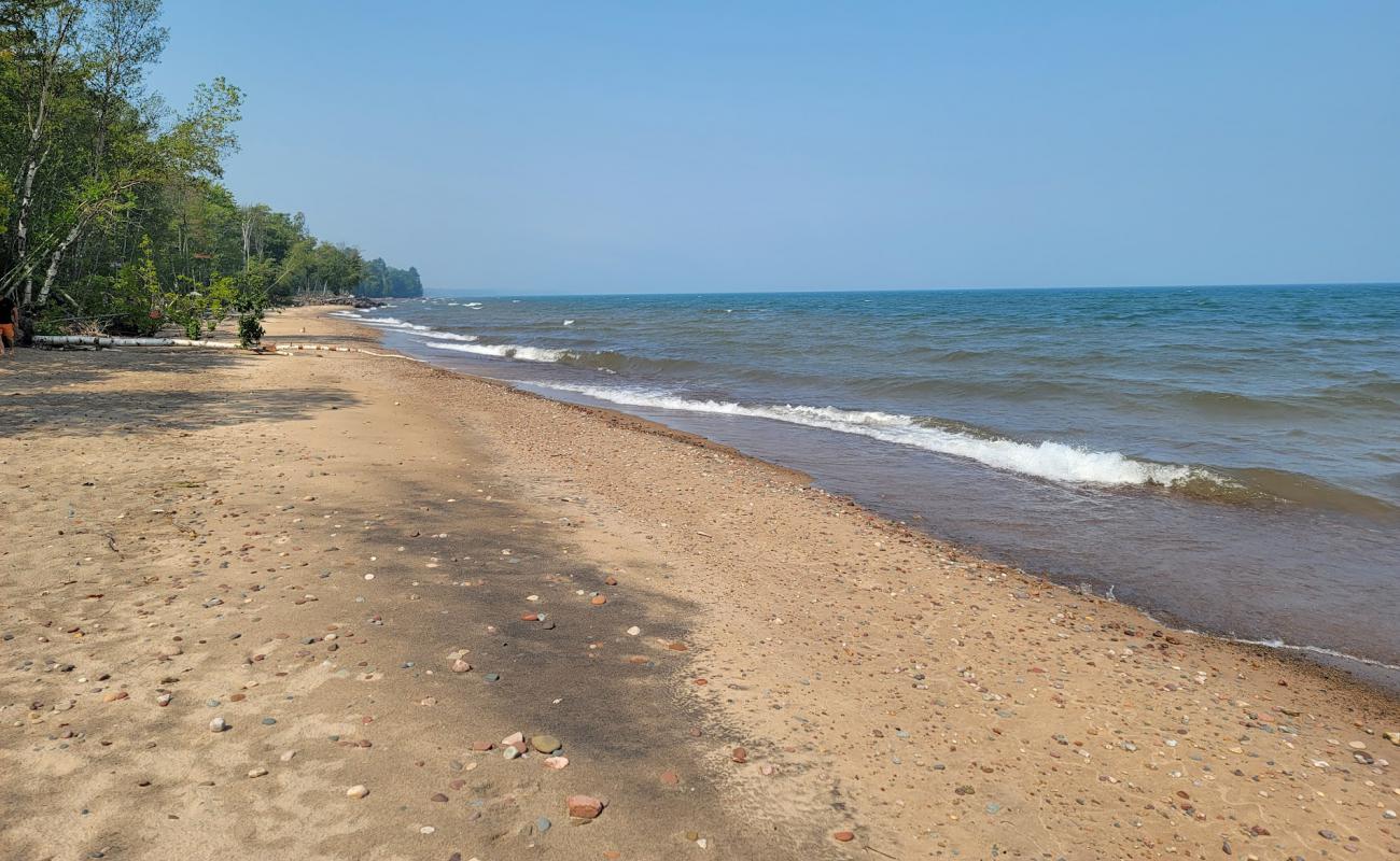 Photo of Green Beach with bright sand surface