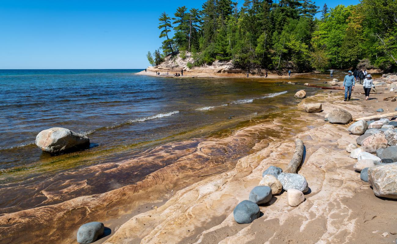 Photo of Mosquito Beach with bright sand & rocks surface