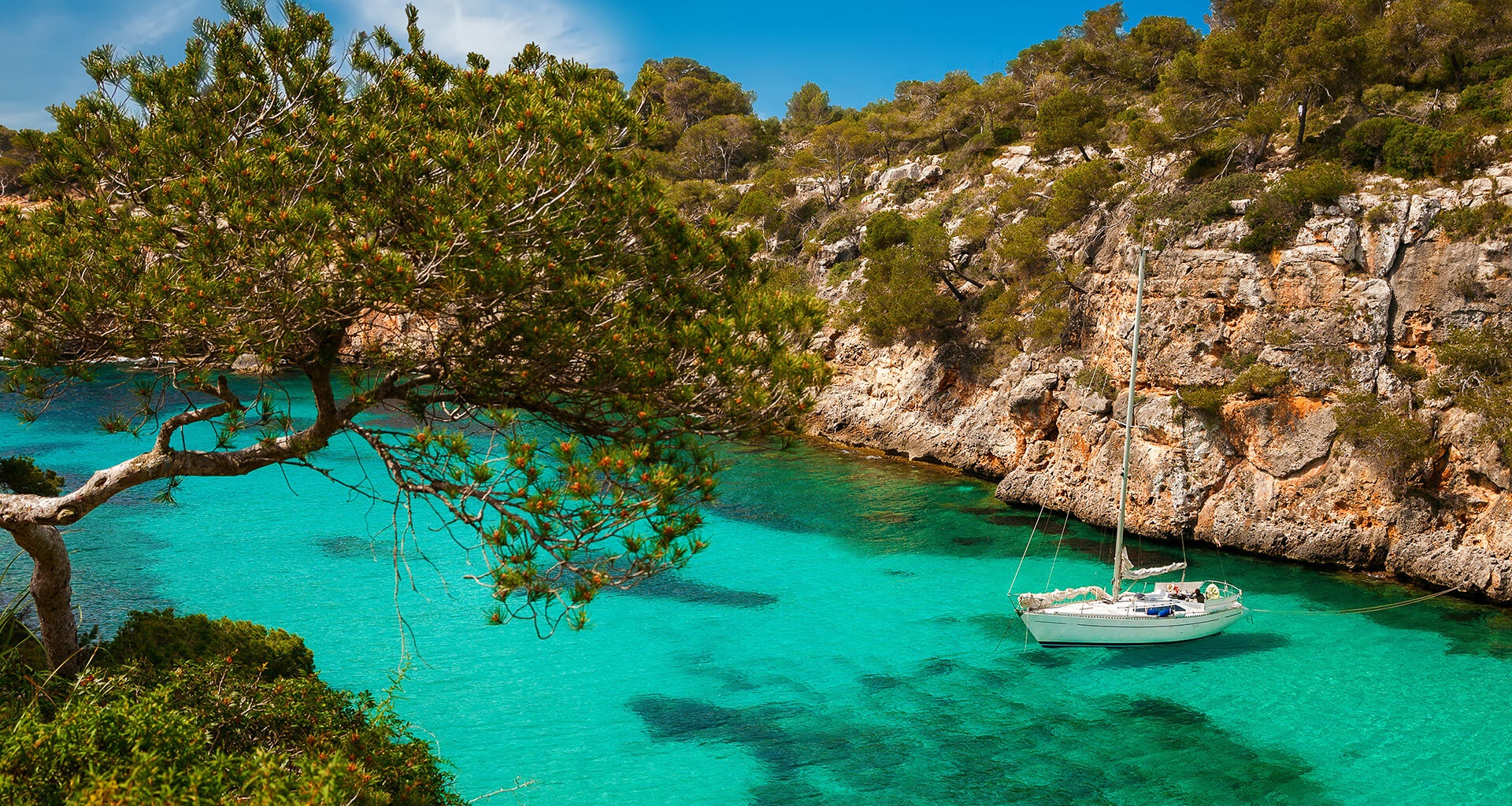 Yacht against rocky cliffs