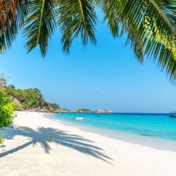 Photo of Eagle Beach with turquoise pure water surface